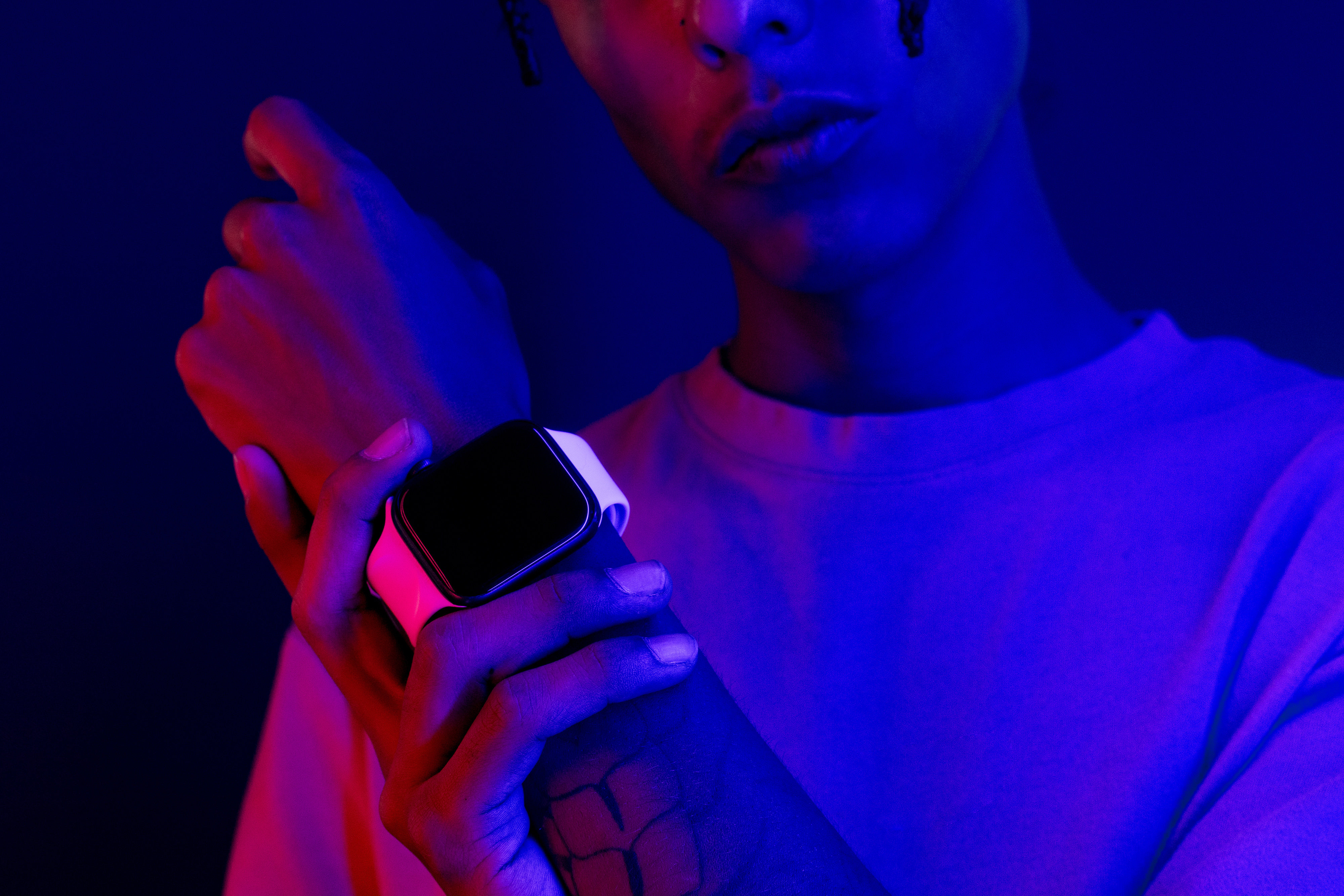 Tech Glow Person Wearing a Smartwatch